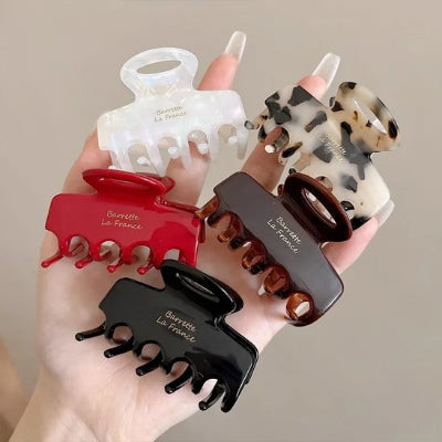 Pince Cheveux Crabe Brillante 5 couleurs en main