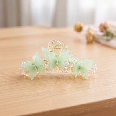 Pince papillons vert menthe